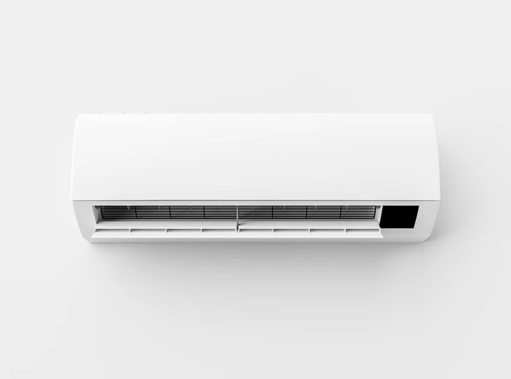 Intérieur moderne avec climatiseur mural blanc installé sur mur gris clair